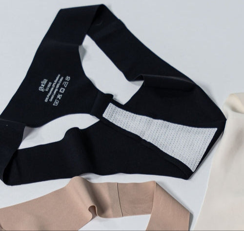Flat lay of Gudia seamless Brazilian underwear in black showing gusset with breathable organic cotton crotch and soft stretch fabric