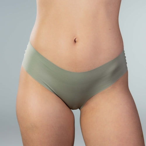 Front view of model wearing Gudia green seamless Brazilian underwear with soft waistband and organic cotton crotch for breathable everyday comfort