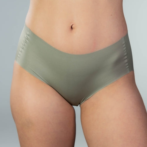 Front view of model wearing Gudia green seamless hipster with mid-rise fit and organic cotton crotch for all-day breathable comfort