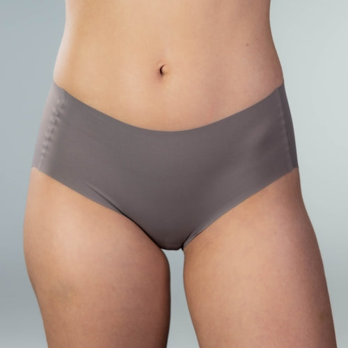 Front close-up view of model wearing Gudia grey seamless hipster with mid-rise fit soft waistband and organic cotton crotch for breathable everyday comfort