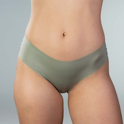 Front view of model wearing Gudia green seamless Brazilian underwear with soft waistband and organic cotton crotch for breathable everyday comfort